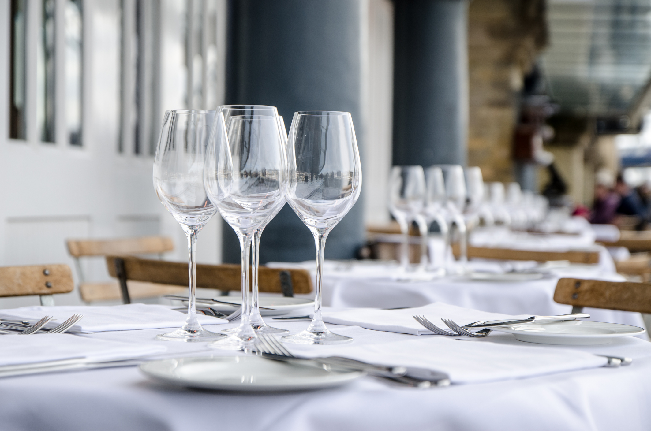 Empty table seen from side on terrace of restaurant