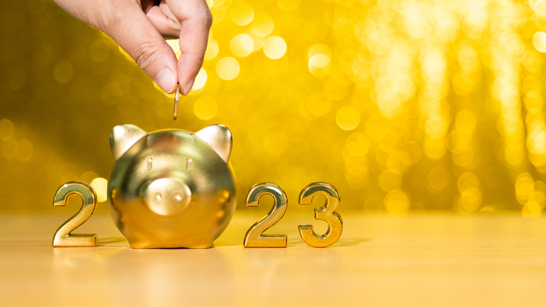 2023 new year and piggy bank on the table